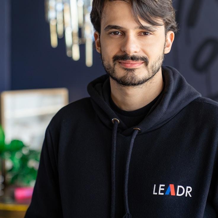 Avery Lin, Lead Design Curator at Velon Atrix Serium, reviewing corporate floral arrangements